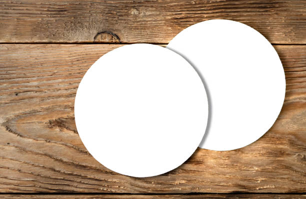 Beer coaster mock up on wooden background White coasters isolated on wooden background. Ready mock up of blank round mat for brewery design, advertising, brand representing coaster stock pictures, royalty-free photos & images