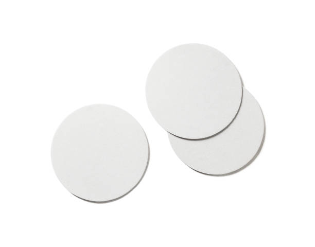 Beer coasters on white Photo of blank beer coasters on white background. Isolated with clipping path. Flat lay. coaster stock pictures, royalty-free photos & images