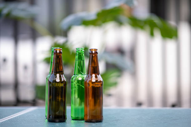 beer glass beer bottles for party nights - empty beer bottle imagens e fotografias de stock