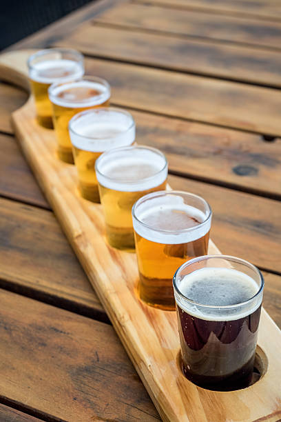 Beer samplers in unique wooden tray stock photo