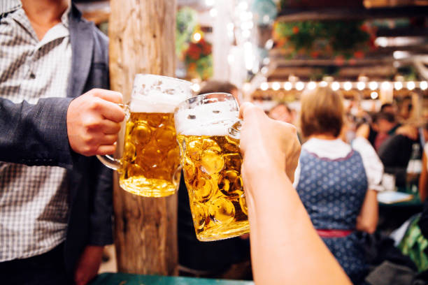 People toast with Oktoberfest beer in Munich, Germany