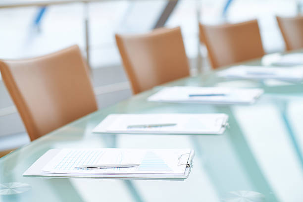 Before annual meeting Boardroom table set for board of directors meeting board room stock pictures, royalty-free photos & images