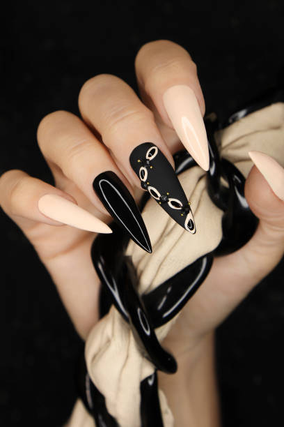 Beige and black manicure. stock photo