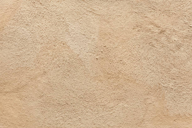 Beige painted stucco wall. stock photo