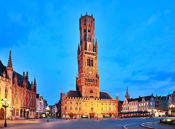 Belfry Tower in Bruges, Belgium Belfry Tower at night, Bruges, Belgium bell tower tower stock pictures, royalty-free photos & images