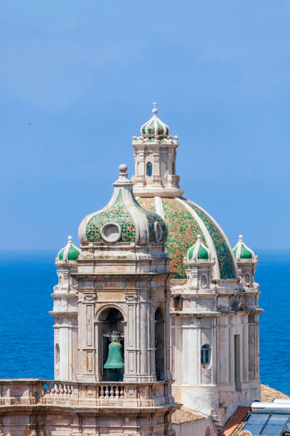 Bell Tower and adjacent Dome above the Cattedrale di S. Lorenzo in Trapini Sicily. stock photo