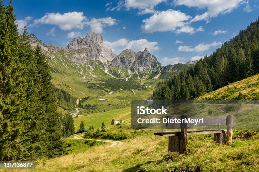 istock Bench with view on big Bischofsmütze, Dachstein mountains, alps 1317136877