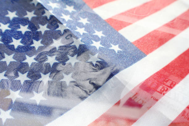 Benjamin Franklin On A One Hundred Dollar Bill With American Flag High Quality Benjamin Franklin On A One Hundred Dollar Bill With American Flag bills patriots stock pictures, royalty-free photos & images
