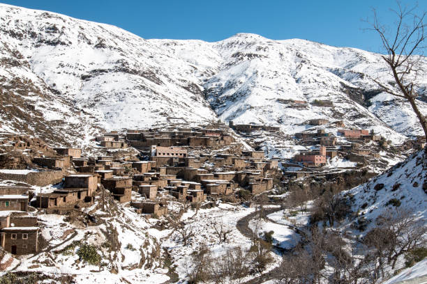 Berber village in the Atlas Mountains in Morocco covered in snow during winter stock photo