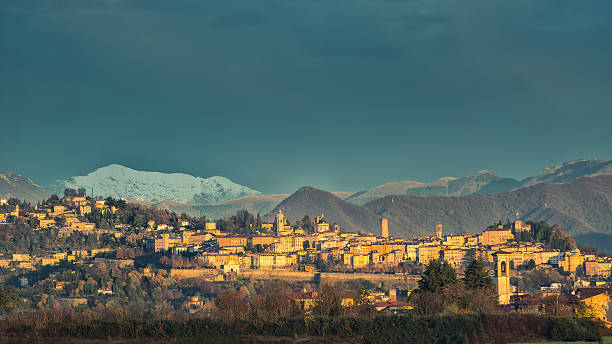 Bergamo Alta  with snow in the mountains stock photo