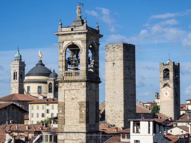 Bergamo, Italy. The old town. Landscape at the city center, the old towers and the clock towers from the ancient fortress Bergamo, Italy. The old town. Landscape at the city center, the old towers and the clock towers from the ancient fortress bell tower tower stock pictures, royalty-free photos & images