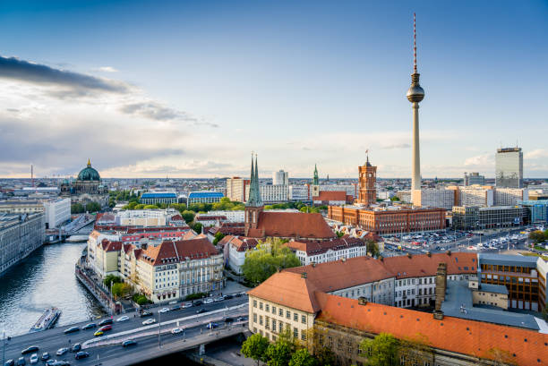 Berlin City Skyline with the Iconic TV Tower and the River Spree Berlin city skyline with the iconic Television Tower at Alexander Platz and the River Spree. Also visible is the town hall "Rotes Rathaus" central berlin stock pictures, royalty-free photos & images