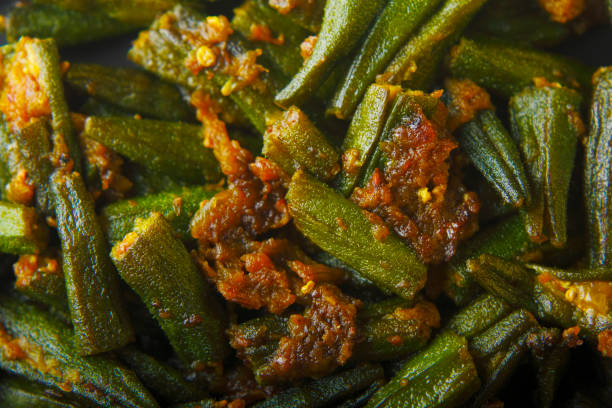 Bharwa Masala Bhindi or Stuffed Okra Bharwa Masala Bhindi or Stuffed Okra is an Indian main course vegetable recipe made using ladies fingers or ochro and spices okra plants pics stock pictures, royalty-free photos & images
