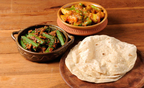 Bhindi masala ladies finger curry, potato beans curry with chapati Bhindi masala ladies finger curry, potato beans curry with chapati chapatti stock pictures, royalty-free photos & images