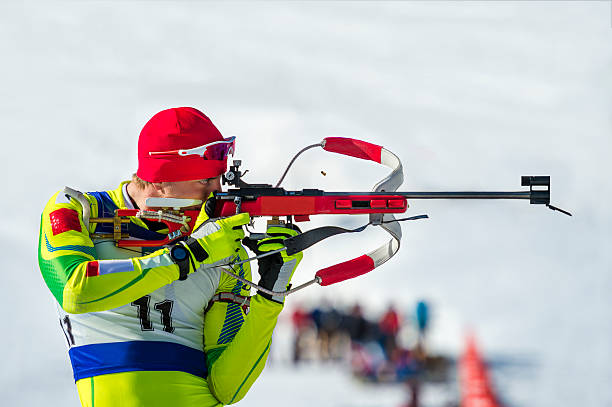 Biathlon competitor at shooting range stock photo