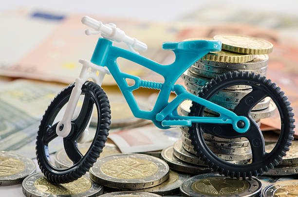 bicycle, coins and banknotes stock photo