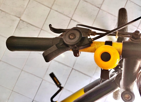 Close Up Bicycle Handlebar and Shifter with Bell of Mountain Bicycle Bike or Track Cycling.