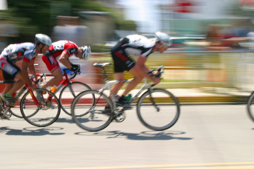 breaking away from the pack. Shot near the last lap of an intense bicycle race.