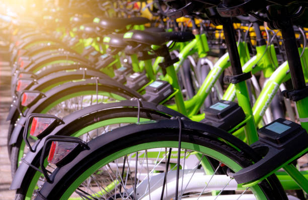 Bicycle sharing systems. Bicycle for rent business. Bicycle for city tour at bike parking station. Eco-friendly transport. Urban economy public transport. Bike station in the park. Healthy lifestyle. stock photo