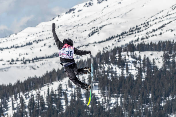 Jumpers and boarders compete at the Hella Big Air Competition in March, 2018 at Mt. Bachelor in Oregon