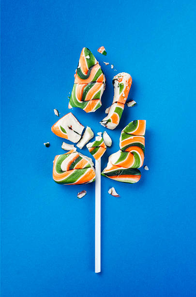Big colorful lollipop candy broken in pieces stock photo
