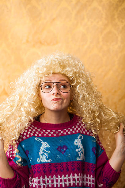 Big Hair Nerdy Girl A nerdy 1990s girl plays with her extreme hair with a cheesy smile on her face.More of this model: ugly girl stock pictures, royalty-free photos & images