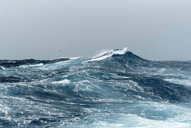 big ocean swells in a stormy sea - atlantische oceaan stockfoto's en -beelden