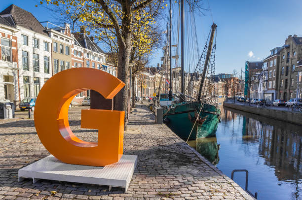 Big orange letter G in the historic center of Groningen, Netherlands Groningen, Netherlands - November 8, 2018: Big orange letter G in the historic center of Groningen, Netherlands groningen city stock pictures, royalty-free photos & images
