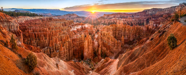big panoramic photo of sunrise in Bryce Canyon National Park. Utah, USA. Panoramic view of Hoodoos in Bryce Canyon National Park at sunrise from between sunset point and inspiration point. Utah. United States of America bryce canyon national park stock pictures, royalty-free photos & images