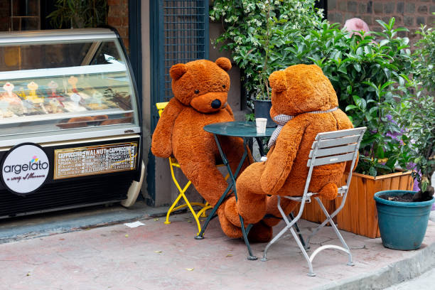 big teddy bears in a sidewalk café. - karaköy istanbul stockfoto's en -beelden