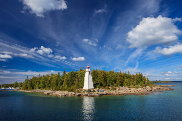 Big Tub Lighthouse located in the Bruce Pininsula of Tobermory, Ontario, Canada. Big Tub Lighthouse located in the Bruce Pininsula of Tobermory, Ontario, Canada. great lakes stock pictures, royalty-free photos & images