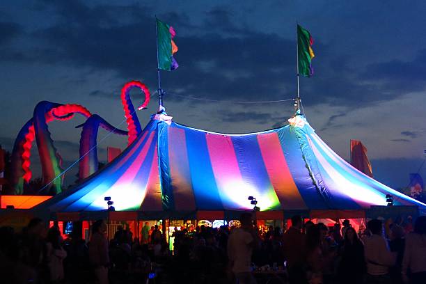 bigtop tent at Glastonbury Festival silhouetted by twilight sky stock photo