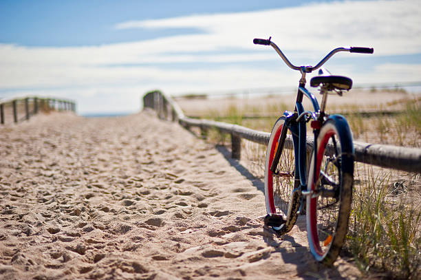 bike left at the beach - fietsen strand stockfoto's en -beelden