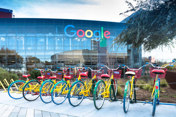 Bikes at Googleplex - Google Headquarters Mountain View, Ca/USA December 29, 2016: Googleplex - Google Headquarters with biked on foreground headquarters stock pictures, royalty-free photos & images