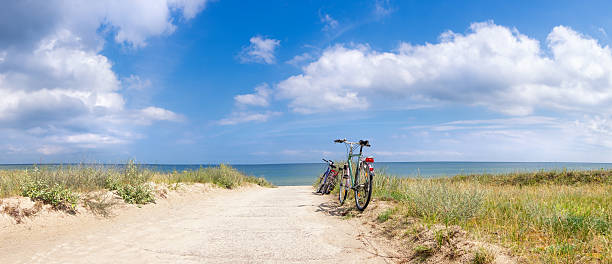 Bikes at the Beach Bikes at the Beach of the Baltic Sea, panorama image rügen stock pictures, royalty-free photos & images
