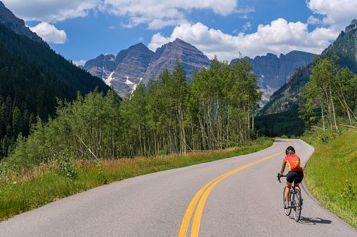 Aspen, Colorado, USA - August 10, 2020: Bike riding on Marron Creek Road, from Highlands to Marron Lake, is the best way to enjoy this one of Colorado's most scenic areas.