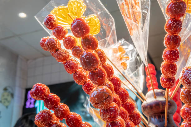 Bingtanghulu: Traditional Chinese street food named Sugar-coated hawthorn fruit stock photo