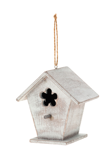Birdhouse on a string hanger - studio shot with a white background