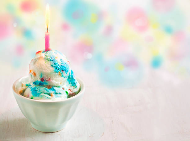 Birthday Cake Ice Cream decorated with candle stock photo