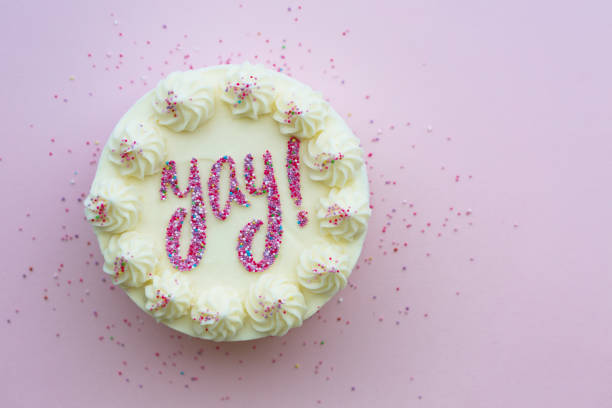 Birthday cake with yay written in sprinkles Birthday cake with yay written in colorful sprinkles cake stock pictures, royalty-free photos & images