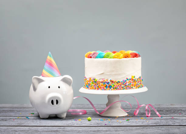 Birthday Money Concept with Rainbow Iced Cake stock photo