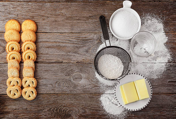 Biscuits butter with ingredients on a wooden surface. stock photo