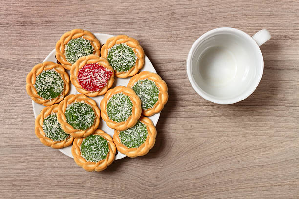 Biscuits on a plate and empty coffee cup. stock photo