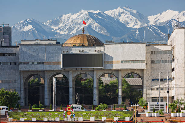 Bishkek, Kyrgyzstan Bishkek, Kyrgyzstan - May 27, 2017: View over the city centre of Bishkek with snow capped mountains in the background. tien shan mountains stock pictures, royalty-free photos & images