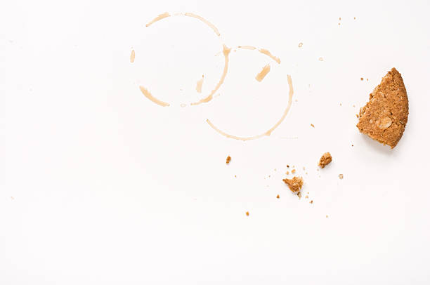 Bisquit crumbs and coffee stains stock photo