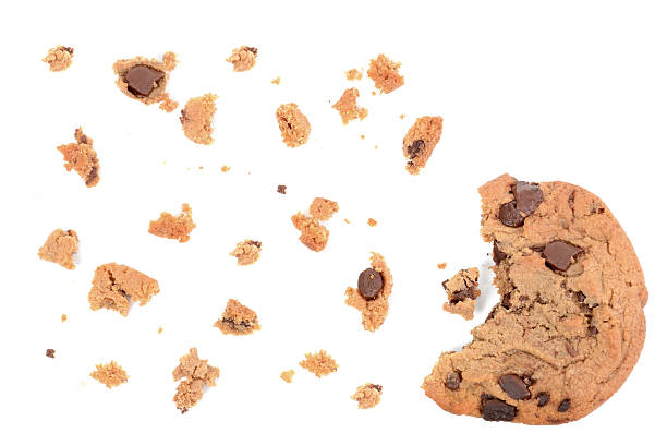 Bit of Cookie chocolate chip cookie pieces isolated on white background crumble stock pictures, royalty-free photos & images
