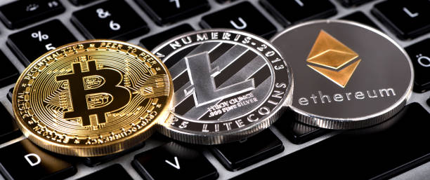 Bitcoin Litecoin Ethereum İstanbul, Turkey - January 24, 2018: Close up shot of Bitcoin, Litecoin and Ethereum memorial coins on a computer keyboard. Bitcoin, Litecoin and Ethereum are crypto currencies and worldwide payment systems.  With Ethereum  stock pictures, royalty-free photos & images