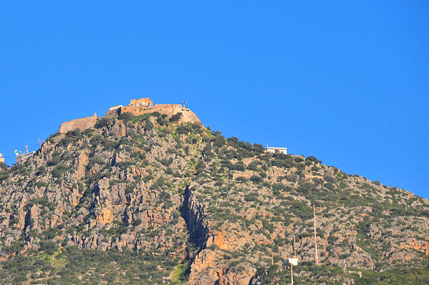 Béjaïa, Algeria: Béjaïa Yemma Gouraya mountain and its fort Béjaïa / Bougie, Kabylia, Algeria: Yemma Gouraya mountain / Djebel Gouraya and its 16th century fort built by the Spanish, that used to house the tomb of Yemma Gouraya, Bejaia's islamic patron saint (Marabout), till its destruction in the 19th century  kabylie stock pictures, royalty-free photos & images