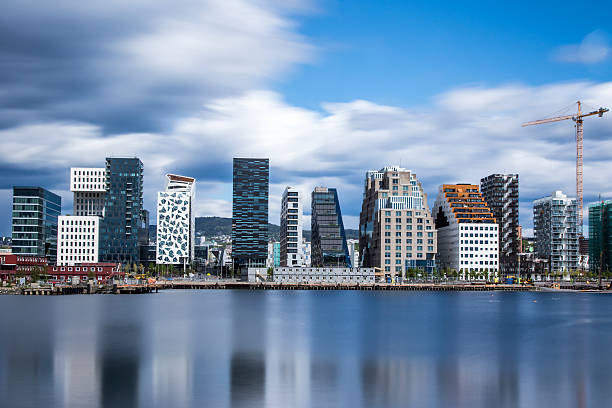 Bjørvika - Bjorvika in Oslo, Norway Bjørvika is a neighborhood in the Sentrum borough of Oslo, Norway. The area is an inlet in the inner Oslofjord, situated between Gamlebyen and Akersness. It serves as an outlet for the river Akerselva. Since the 2000s, it has been undergoing urban redevelopment, being transformed from a container port. The neighborhood will be Oslo's cultural "center." The National Opera is currently at Bjørvika, and the Munch/Stenersen museum might be built here, replacing the Munch Museum. A number of new roads are under construction and the Bjørvika Tunnel opens in May 2010. oslo stock pictures, royalty-free photos & images