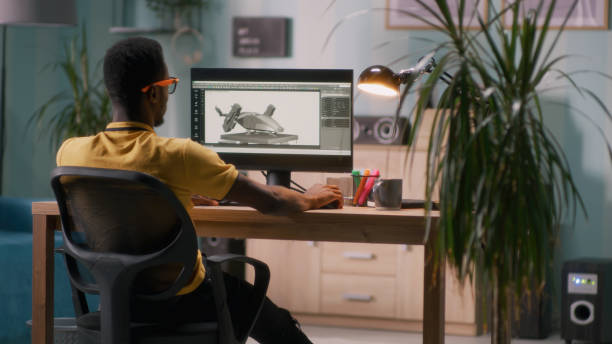 Black 3D designer working in home office stock photo
